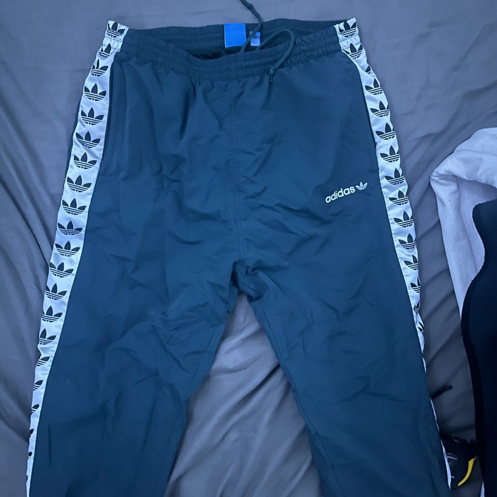 Adidas Black Sweatpants with Iconic Side Stripes